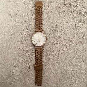 Women’s rose gold with pearl dial MVMT watch